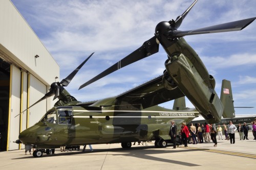 MARINE CORPS AIR FACILITY QUANTICO, Va. -- Marine Helicopter Squadron One Marines, past and present, family members and friends mingle on the flight line with the newest addition to the squadron, a MV-22 B ?Osprey,? after a MV-22B Introduction Ceremony in the HMX-1 hangar on May 4, 2013. HMX-1 is scheduled to receive 11 more MV-22B by next summer.(U.S. Marine Corps photo by Sgt. Rebekka S. Heite/Released)