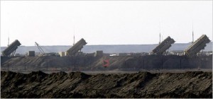 U.S. PATRIOT MISSILE LAUNCHERS LINED UP IN MILITARY CAMP IN KUWAITI DESERT NEAR IRAQ BORDER
