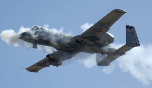 An A-10 from the 355th Wing at Davis-Monthan Air Force Base, Ariz., delivers a volley of 30mm rounds to a stationary ground target during the Hawgsmoke A-10 gunnery and bombing competition at the Barry Goldwater Range complex in Arizona. Four pilots from Air Force Reserve Command’s 442nd Fighter Wing, 303rd Fighter Squadron took first place overall in the competition March 22-25 flying aircraft from the 355th Wing, as their own A-10s are being prepared for an overseas deployment. (U.S. Air Force photo by Senior Airman Christina D. Ponte)